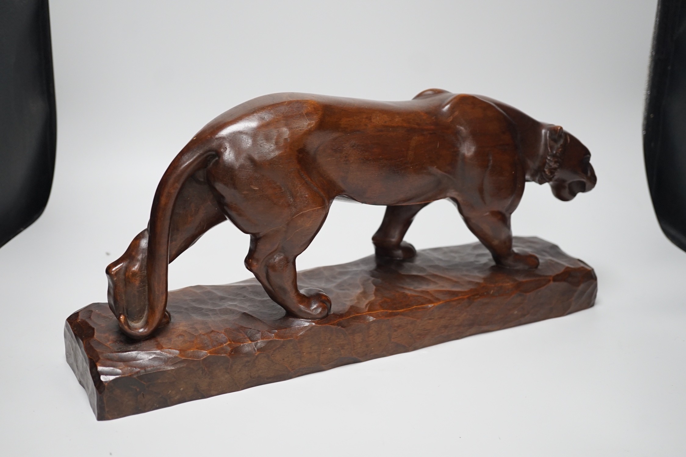 A French carved walnut model of a tiger, signed Chartron, 47cms wide